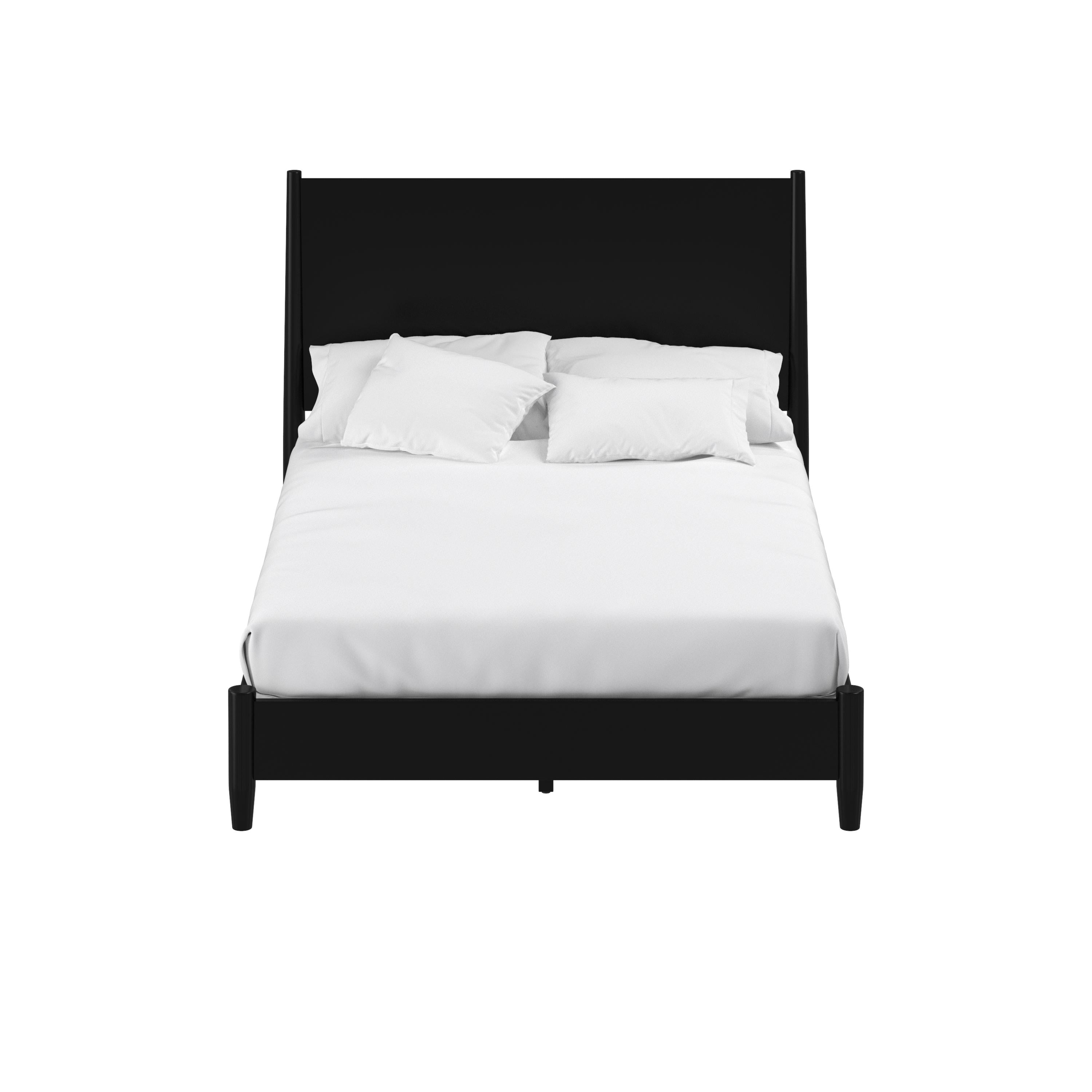 Black bed frame with white bedding on a white background