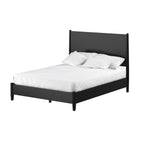 Black metal bed frame with white bedding on a white background
