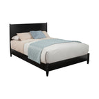 Bed with black frame and beige bedding on a white background