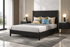 Bedroom with a black bed frame, gray bedding, and decorative pillows.
